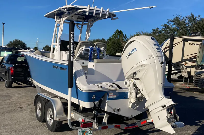 Slide: The Image of 2023 Sportsman Open 242 Center Console boat with Yamaha engine on trailer. - 3