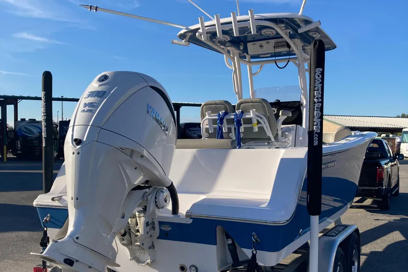 Slide: The Image of 2023 Sportsman Open 242 Center Console boat with Yamaha outboard motor on trailer. - 4