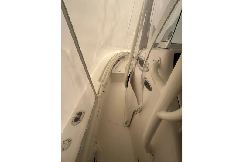 Slide: The Image of 2016 Regulator 25 boat interior with white upholstery and sleek design. - 7