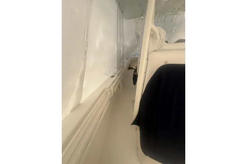 Slide: The Image of Interior view of a 2016 Regulator 25 boat, showcasing seating and side panel. - 9