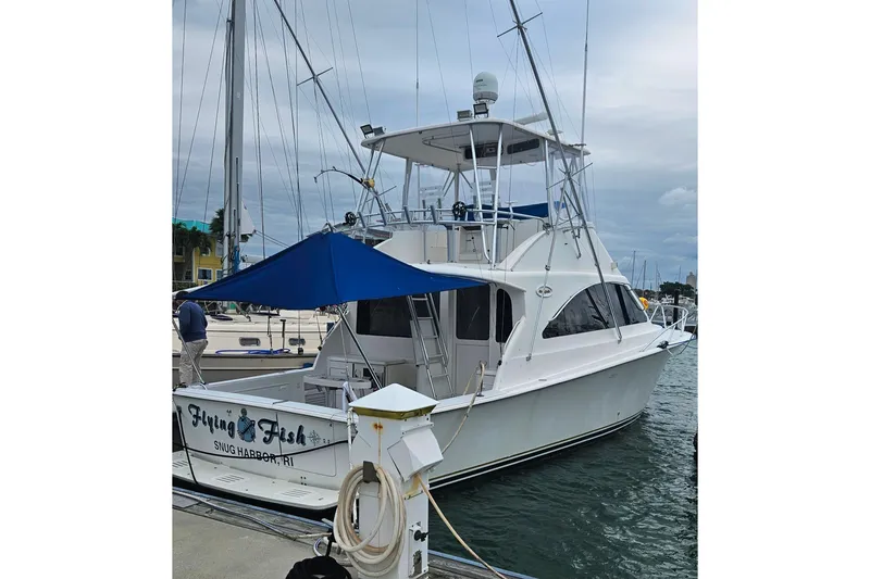 The Image of 2000 Ocean Yachts 40 Super Sport docked at marina with blue canopy. - 0