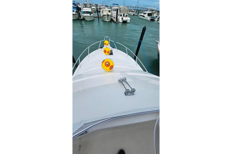 Slide: The Image of Bow view of 2000 Ocean Yachts 40 Super Sport docked at marina. - 14