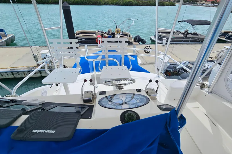 Slide: The Image of Cockpit view of a 2000 Ocean Yachts 40 Super Sport docked at a marina. - 15