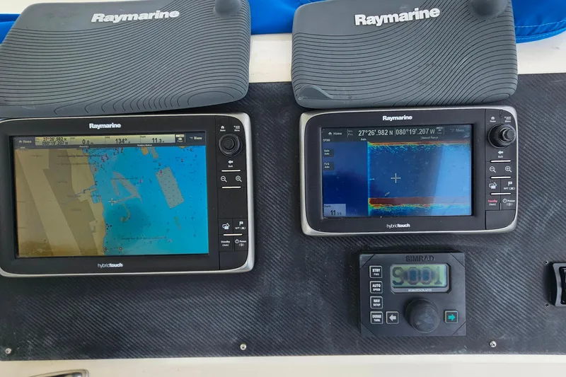 Slide: The Image of Raymarine navigation displays on a 2000 Ocean Yachts 40 Super Sport boat dashboard. - 20