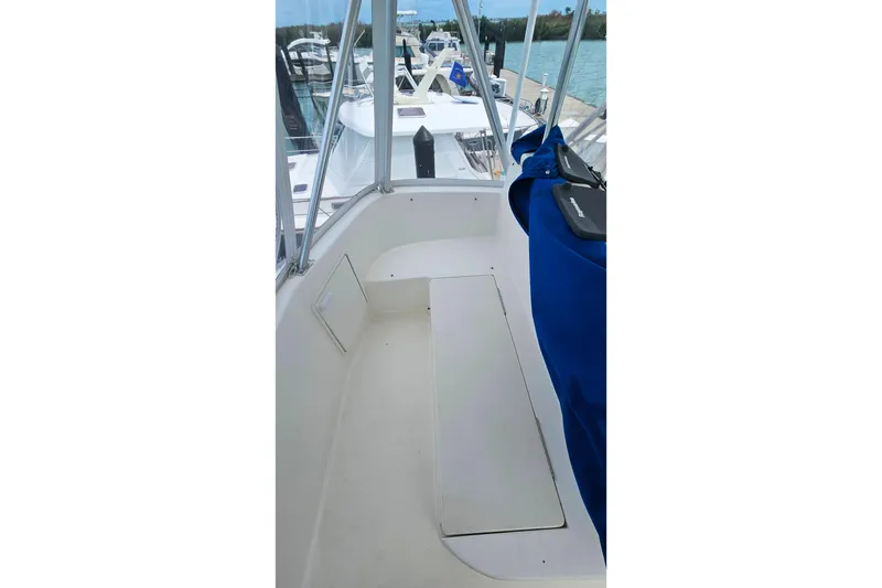 Slide: The Image of 2000 Ocean Yachts 40 Super Sport boat deck with seating, docked at marina. - 23