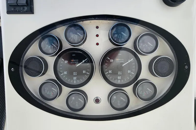 Slide: The Image of Dashboard of a 2000 Ocean Yachts 40 Super Sport with multiple gauges and dials. - 27