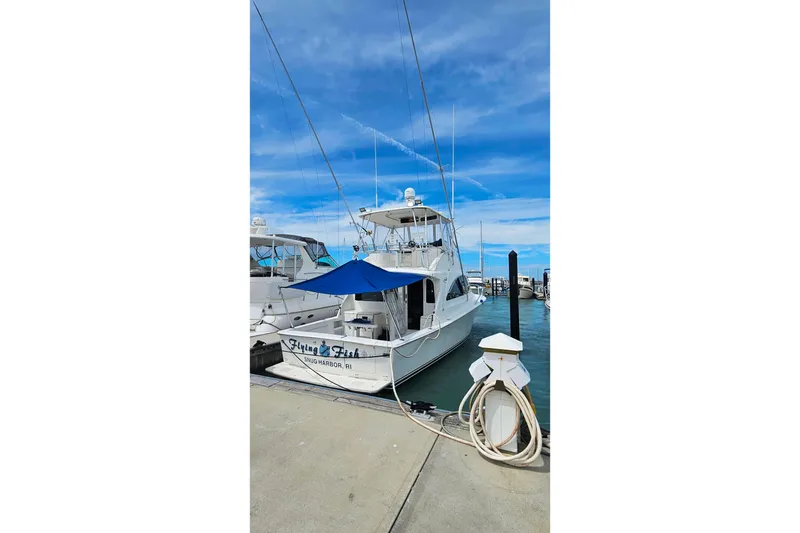 Slide: The Image of Ocean Yachts 40 Super Sport 2000 docked at marina with blue sky background. - 3