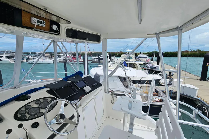 Slide: The Image of Cockpit view of 2000 Ocean Yachts 40 Super Sport docked at marina. - 31