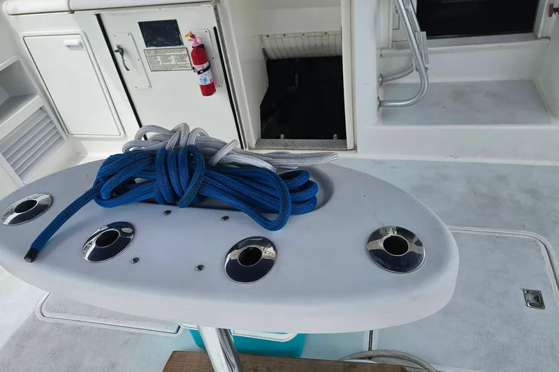 Slide: The Image of Deck of 2000 Ocean Yachts 40 Super Sport with coiled ropes and fishing rod holders. - 32