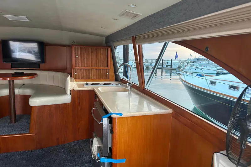 Slide: The Image of Interior of 2000 Ocean Yachts 40 Super Sport with kitchen and seating area. - 36