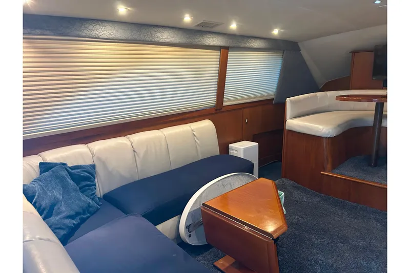 Slide: The Image of Luxurious interior of 2000 Ocean Yachts 40 Super Sport with plush seating and elegant wood finishes. - 37