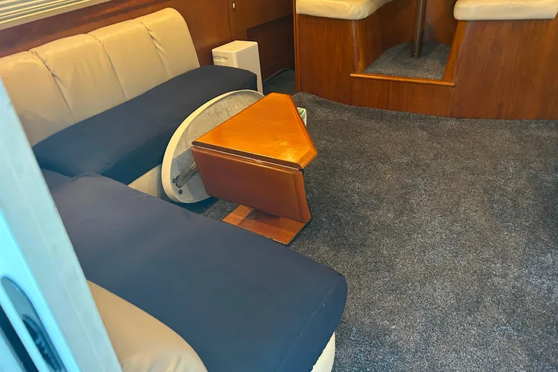 Slide: The Image of Interior of 2000 Ocean Yachts 40 Super Sport with seating and wooden table. - 38