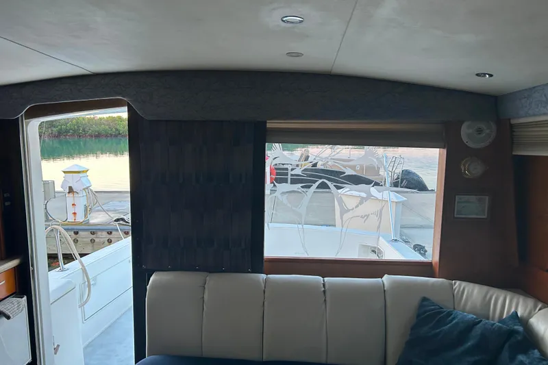 Slide: The Image of Interior view of a 2000 Ocean Yachts 40 Super Sport, featuring a marina backdrop. - 40