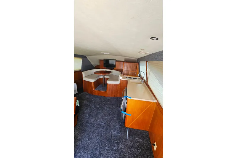 Slide: The Image of Interior of 2000 Ocean Yachts 40 Super Sport with kitchen and seating area. - 42