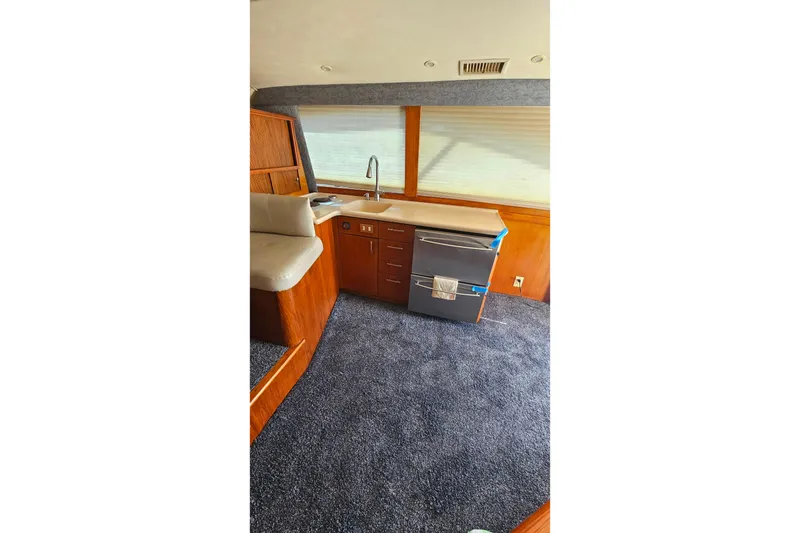 Slide: The Image of Interior of 2000 Ocean Yachts 40 Super Sport with kitchenette and seating area. - 44