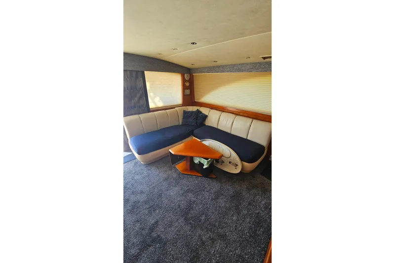 Slide: The Image of Luxurious interior of 2000 Ocean Yachts 40 Super Sport with plush seating and elegant table. - 46