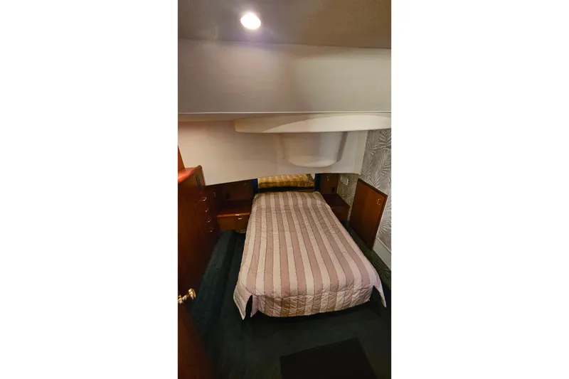 Slide: The Image of Interior cabin of 2000 Ocean Yachts 40 Super Sport with bed and wooden cabinetry. - 50