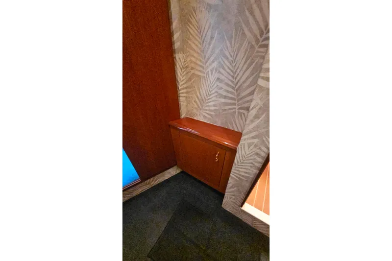 Slide: The Image of Interior of 2000 Ocean Yachts 40 Super Sport with wooden cabinet and patterned wallpaper. - 51