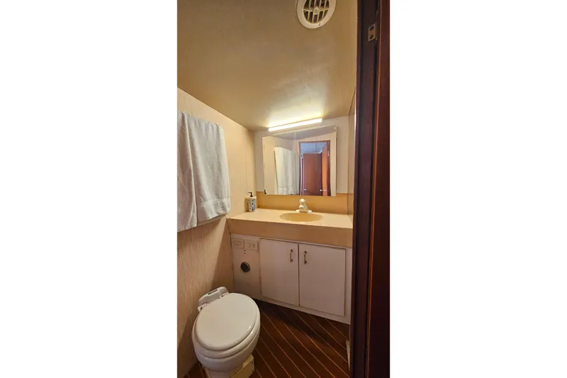 Slide: The Image of Bathroom interior of 2000 Ocean Yachts 40 Super Sport with sink and toilet. - 54