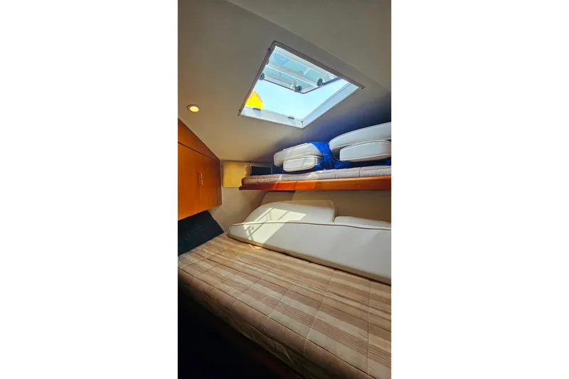 Slide: The Image of Interior cabin of 2000 Ocean Yachts 40 Super Sport with skylight and bedding. - 57