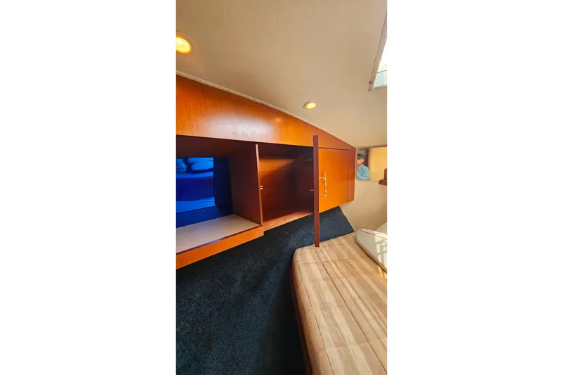 Slide: The Image of Interior cabin of 2000 Ocean Yachts 40 Super Sport with wooden cabinetry. - 59