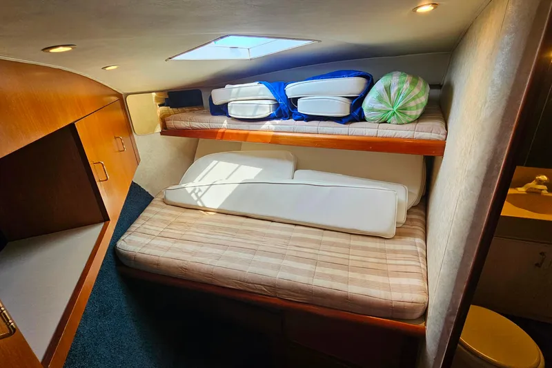 Slide: The Image of Interior cabin of 2000 Ocean Yachts 40 Super Sport with bunk beds and storage. - 60