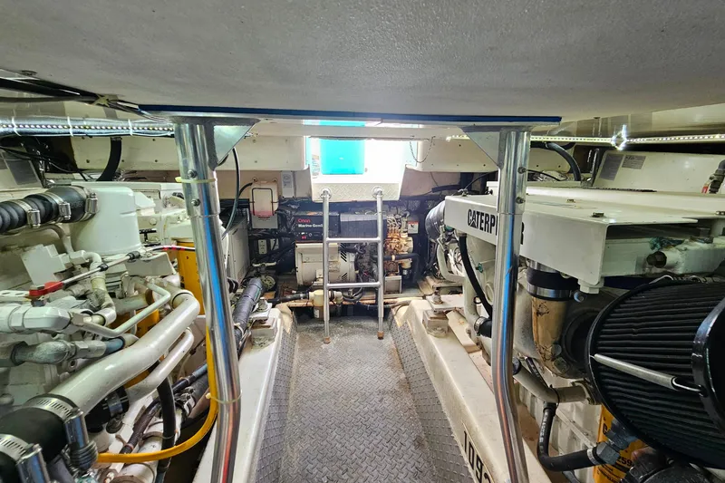 Slide: The Image of Engine room of a 2000 Ocean Yachts 40 Super Sport, featuring Caterpillar engines. - 63