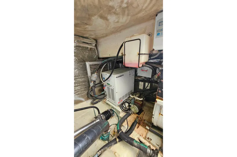 Slide: The Image of Engine room of 2000 Ocean Yachts 40 Super Sport with mechanical components. - 65