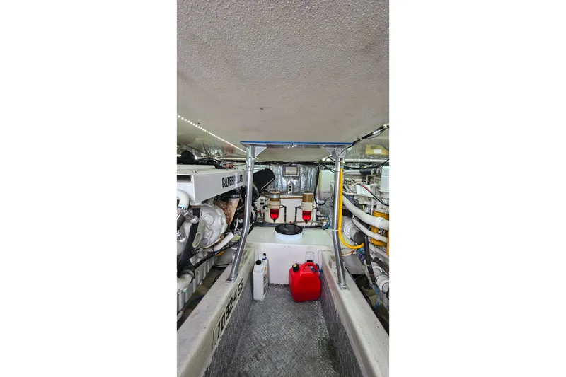 Slide: The Image of Engine room of 2000 Ocean Yachts 40 Super Sport with Caterpillar engine components. - 67