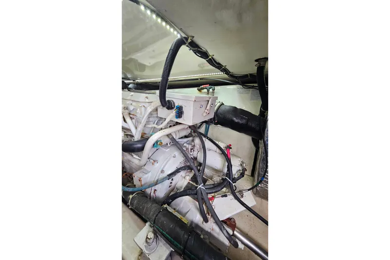 Slide: The Image of Engine compartment of a 2000 Ocean Yachts 40 Super Sport, showcasing mechanical components. - 68