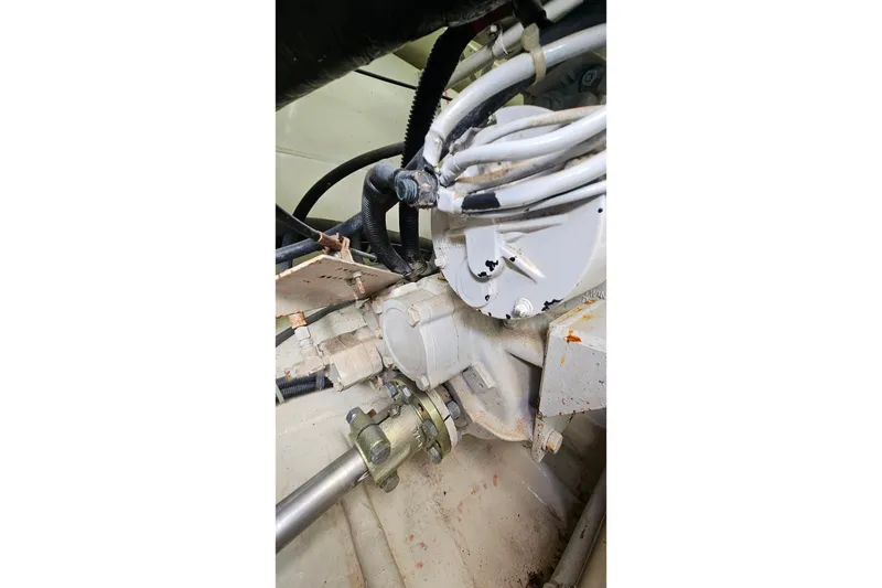 Slide: The Image of Engine compartment of a 2000 Ocean Yachts 40 Super Sport, showing mechanical components. - 69
