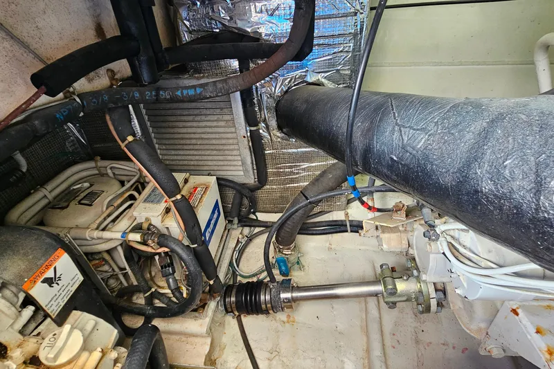 Slide: The Image of Engine room of a 2000 Ocean Yachts 40 Super Sport with visible machinery and piping. - 71