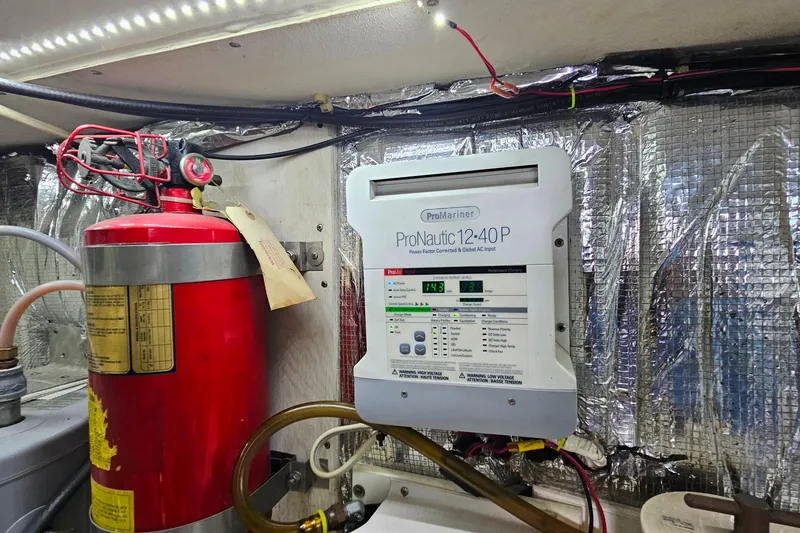 Slide: The Image of Engine room of 2000 Ocean Yachts 40 Super Sport with fire extinguisher and ProNautic charger. - 75