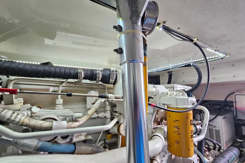 Slide: The Image of Engine room of a 2000 Ocean Yachts 40 Super Sport, showcasing mechanical components. - 79
