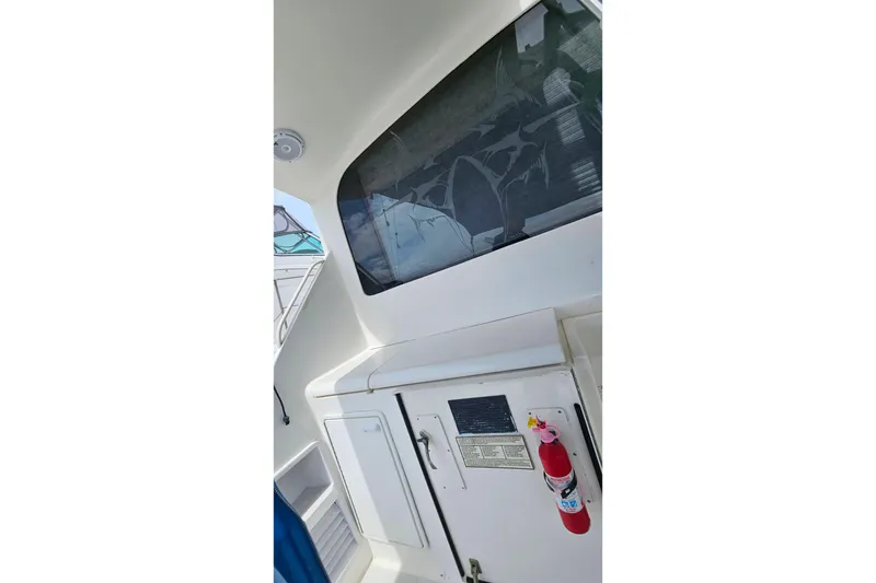 Slide: The Image of Interior view of a 2000 Ocean Yachts 40 Super Sport with a fire extinguisher. - 90