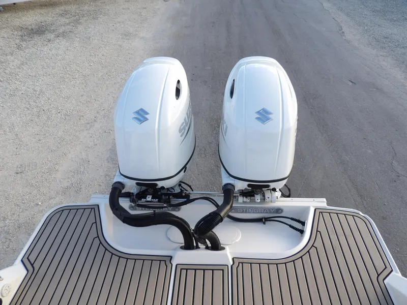 Slide: The Image of Twin Suzuki outboard engines on a 2022 Stingray 269 DC boat, rear view. - 11