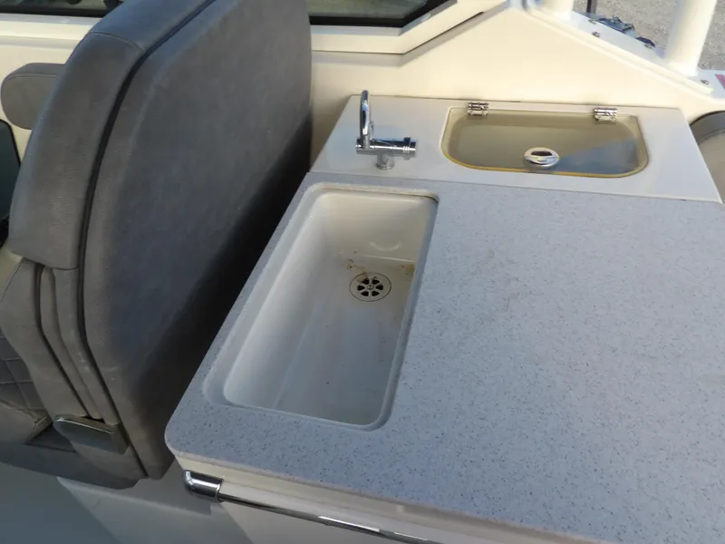 Slide: The Image of 2022 Stingray 269 DC boat interior with sink and countertop detail. - 19