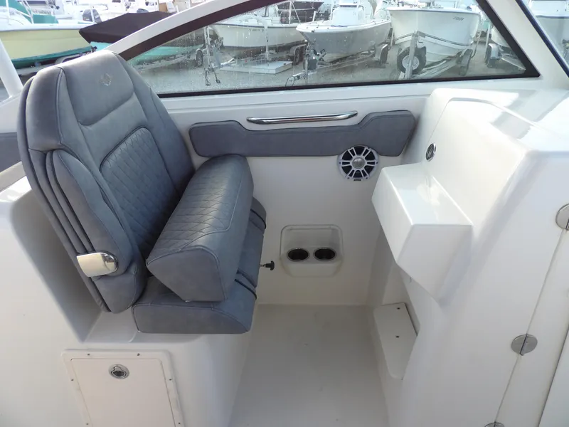 Slide: The Image of 2022 Stingray 269 DC boat interior with gray seating and modern design. - 36