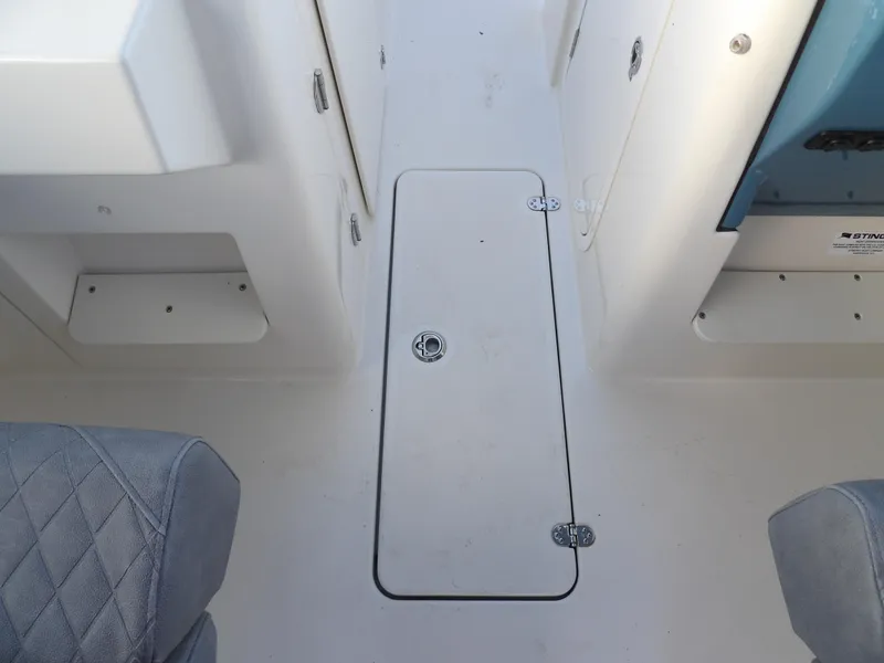 Slide: The Image of Interior view of 2022 Stingray 269 DC boat, featuring a storage compartment. - 40