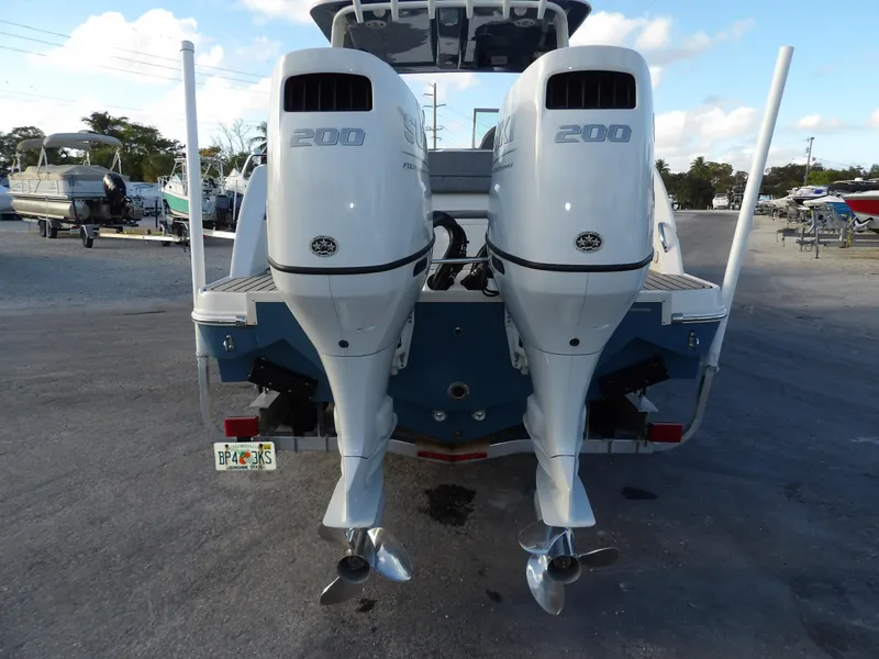 Slide: The Image of 2022 Stingray 269 DC boat with dual 200 horsepower outboard engines, rear view. - 7