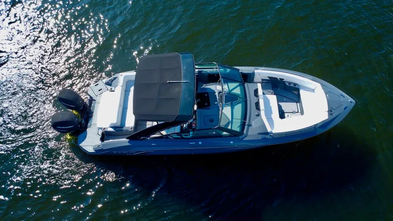 Slide: The Image of 2021 Cruisers Yachts 338 South Beach Edition Bow Rider on water, aerial view. - 11