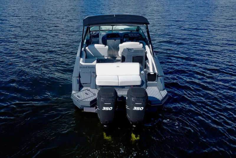 Slide: The Image of 2021 Cruisers Yachts 338 South Beach Edition Bow Rider on water, rear view. - 2