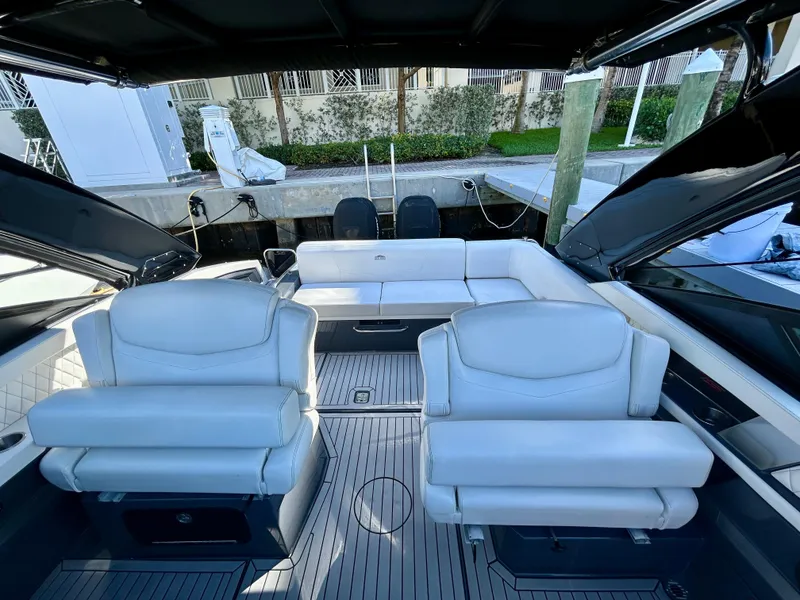 Slide: The Image of 2021 Cruisers Yachts 338 South Beach Edition Bow Rider with luxurious white seating and sleek design. - 30