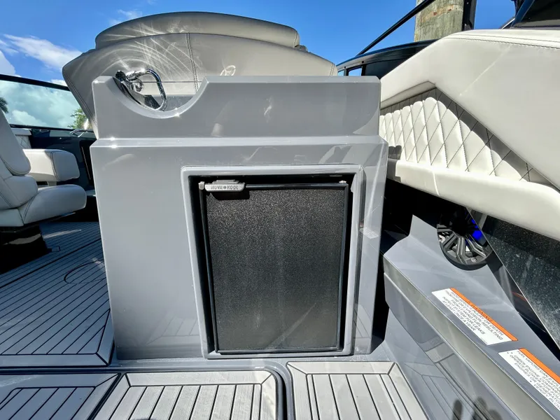 Slide: The Image of 2021 Cruisers Yachts 338 South Beach Edition Bow Rider interior with sleek seating and storage. - 35
