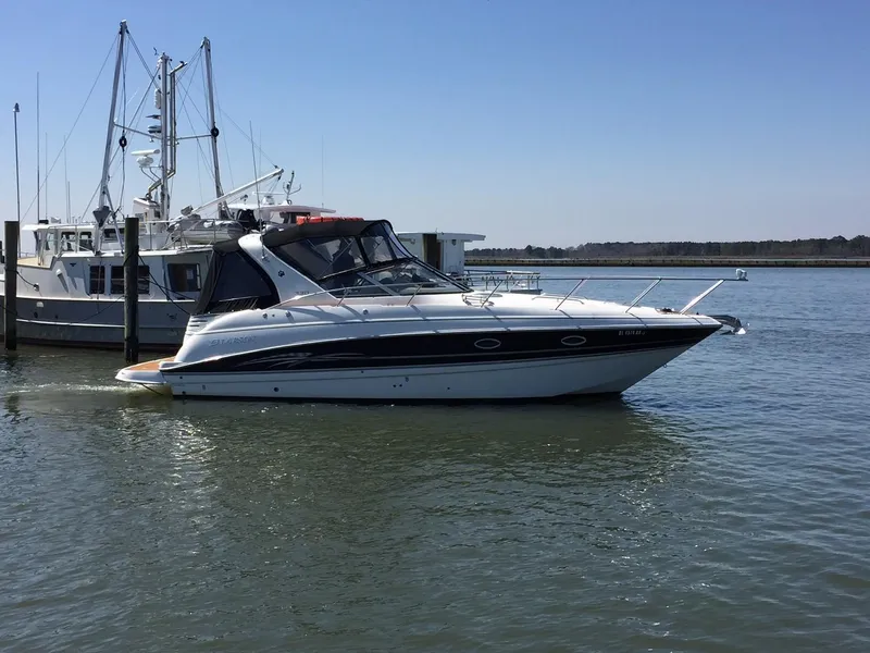 The Image of 2009 Larson Cabrio 330 Day Cruiser in harbor. - 0