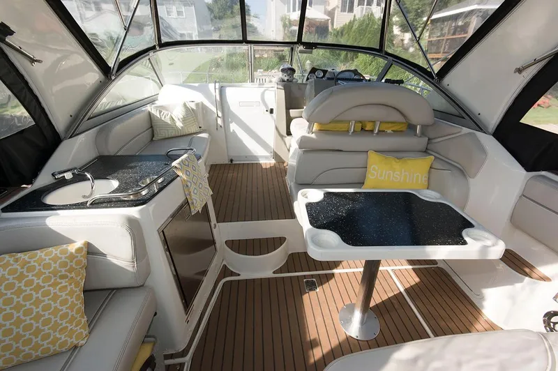 Slide: The Image of Interior of a 2009 Larson Cabrio 330 Day Cruiser with stylish furnishings. - 4