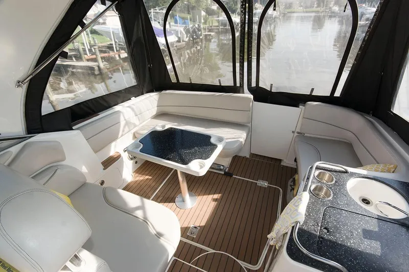 Slide: The Image of Interior of a 2009 Larson Cabrio 330 Day Cruiser with seating area. - 5