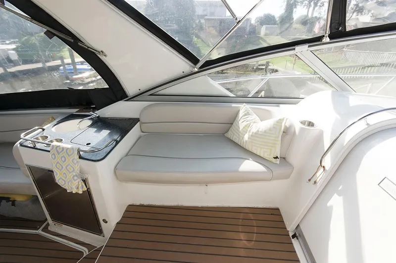 Slide: The Image of Interior of a 2009 Larson Cabrio 330 Day Cruiser with seating and cushion. - 6