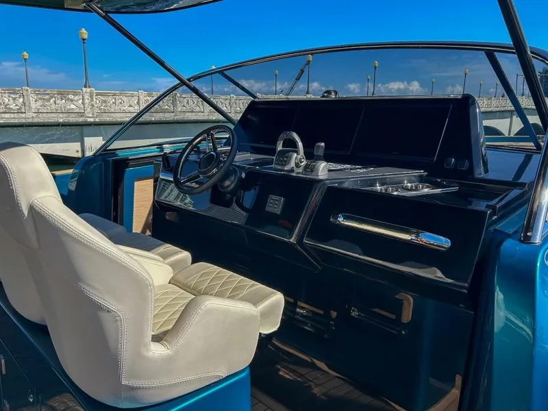 Slide: The Image of 2024 Solaris Power 52 Open yacht helm station with luxurious seating. - 24