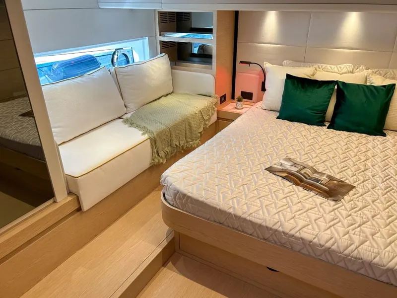 Slide: The Image of Luxurious bedroom interior of 2024 Solaris Power 52 Open yacht with cozy seating area. - 31